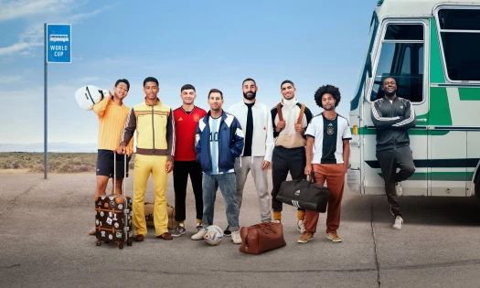 Famous soccer players and Stormzy in football gear on the side of the road