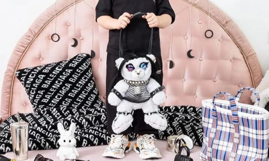 Cropped photo from Balenciaga Objects campaign, pictured plush teddy bear bag in BDSM gear