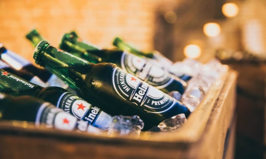 Heineken bottles in a box full of ice