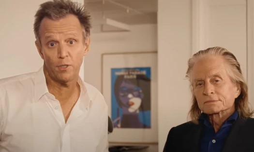 Michael Douglas and Maurice Lévy look into the camera