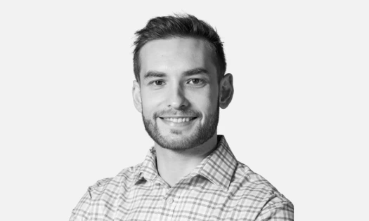 Black and white portrait of Luis Pava, SVP of People, Operations and Technology at BairesDev