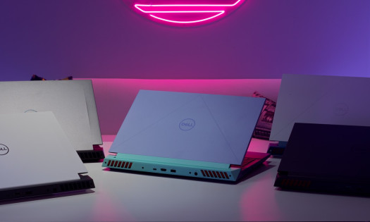 Dell laptops in various colors on white desk