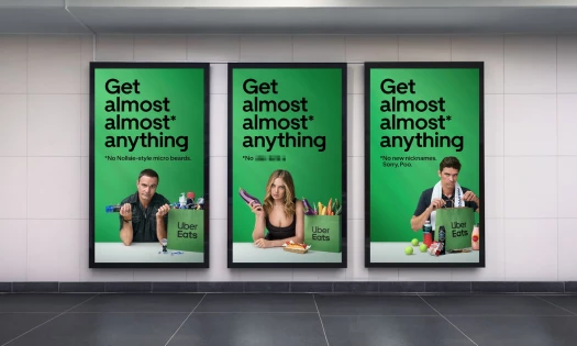 Three green Uber Eats posters with Australian celebrities featuring "Get almost almost anything" slogan