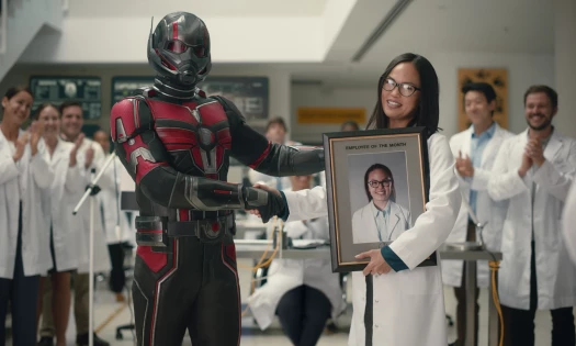 Ant-man shakes hands with engineer in lab