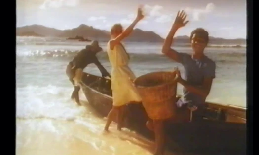 Screenshot from 80's Lilt advert picturing people on a tropical island