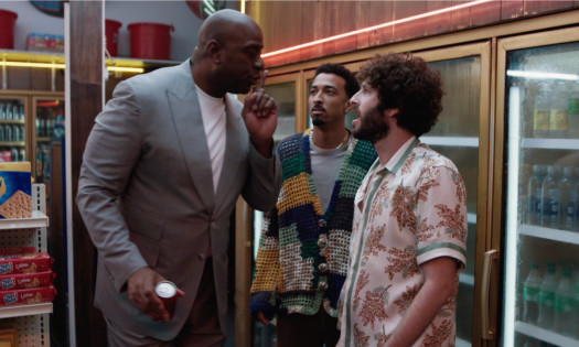 Magic Johnson with Lil Dicky and Travis Bennett in a bodega