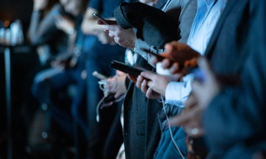 Crowd of people with smartphones in their hands