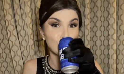 Dylan Mulvaney drinking Bud Light