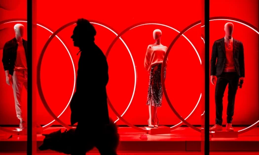 Fashion window display bathed in neon light