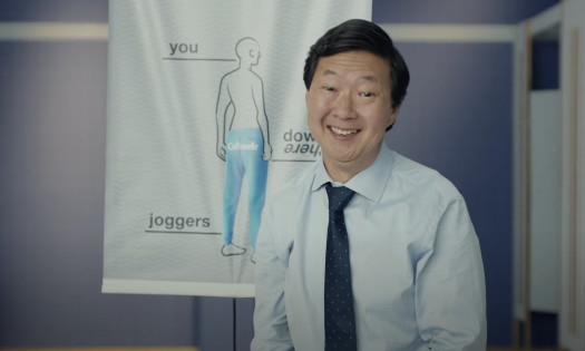 Ken Jeong presenting how to wear cottonelle