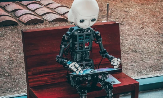 AI-powered robot working on a tablet