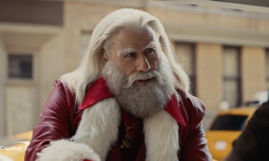 Still photograph from the Capital One 2023 Christmas ad featuring John Travolta dressed as Santa Clause
