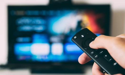Person Controlling Remote