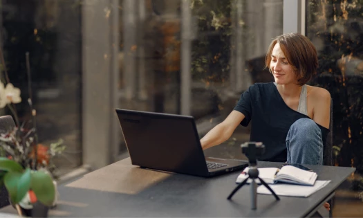 Photo of a woman working from home on her laptop