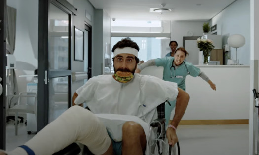 A Patient Eating a McDonald's Burger Being Chased by a Nurse