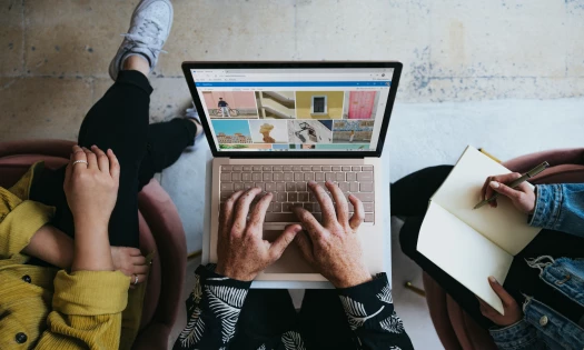 A Person Using A Laptop