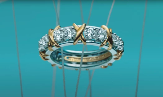Still taken from the Clio Awards Tiffany promotional video featuring the crossed-stitched diamond ring