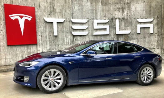 Tesla Logo and Electric Vehicle