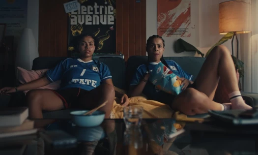 Twin sisters sitting together