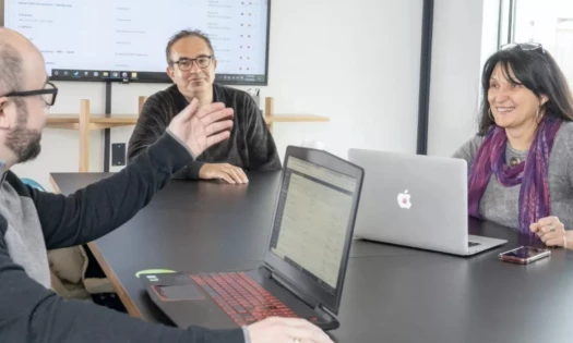 The Web Loft Designs Team in a Meeting