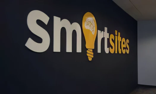 A photo of the Smartsites logo, featuring a light bulb representing ideas