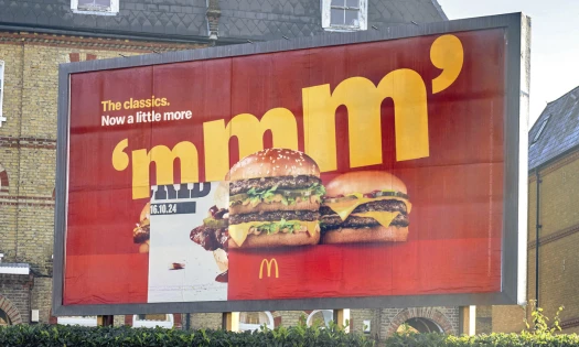 A McDonald's billboard for the Big Mac with a different panel showing the McRib and 16.10.24