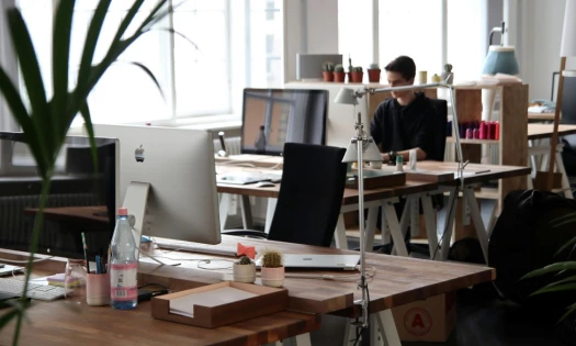 Man Sitting in Front of Computer at the Office