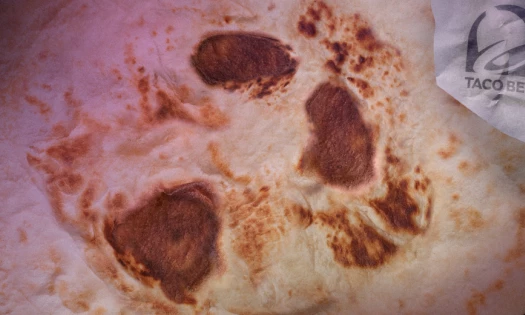 A Taco Bell Tortilla with a ghostly face