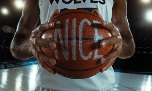 A Minnesota Timberwolves player holds a basketball