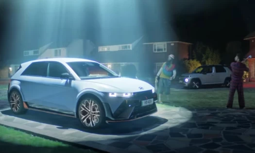 The Hyundai IONIQ 5 N with a light shining down on it from a supposed UFO
