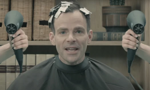 Supercuts' CDO John Davi having his hair done with two blow dryers