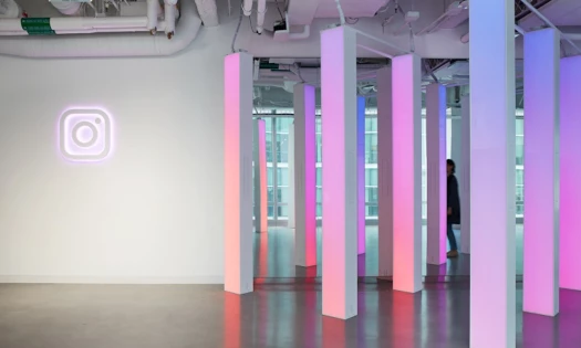 Instagram office with neon logo and pillars