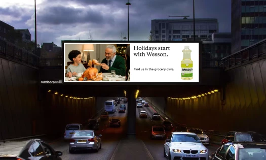 Wesson billboard above a busy street