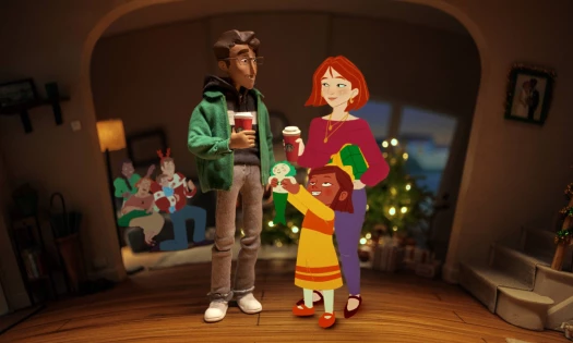 A family celebrating Christmas with Starbucks coffee in hand