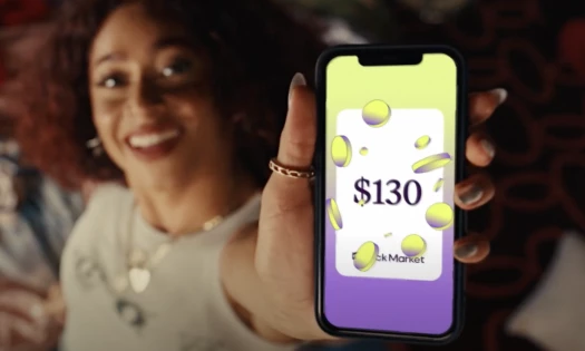 Dancer Yoe Apolinario holding a cellphone with a $130 value on Back Market's app