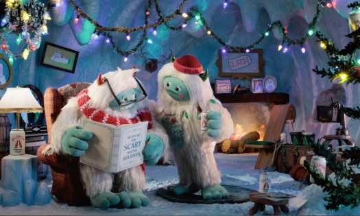 New Olipop mascots, Oli and Pop, read a book
