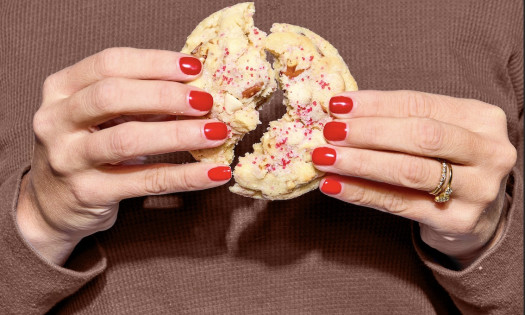 McCormick pure vanilla and pure peppermint bottles with stacked cookies