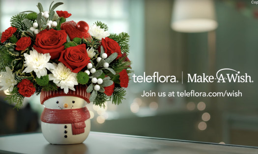 Boy saluting a snowman