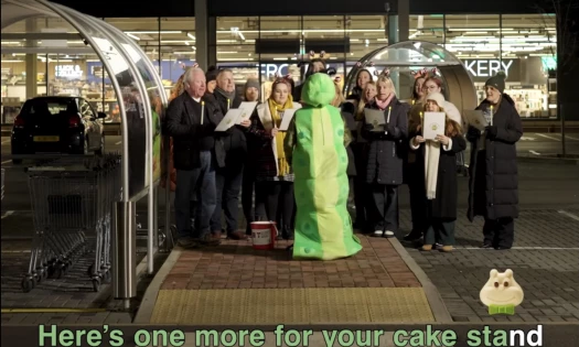Cuthbert choir in front of M&S store