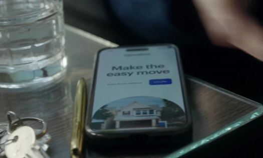 Phone on a coffee table with the Opendoor app open