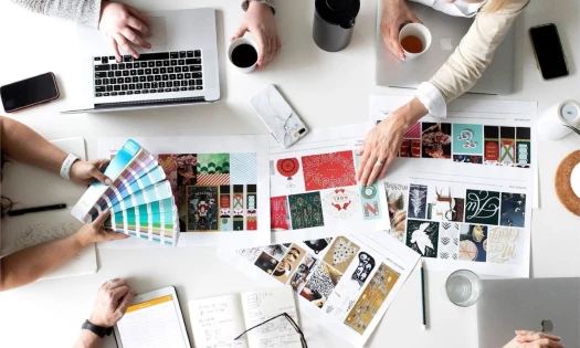willoughby design joins icom, people having a meeting