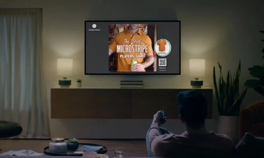 Living room with flat screen TV and social media ads showing