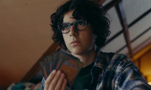 A boy plays 'Magic: The Gathering'