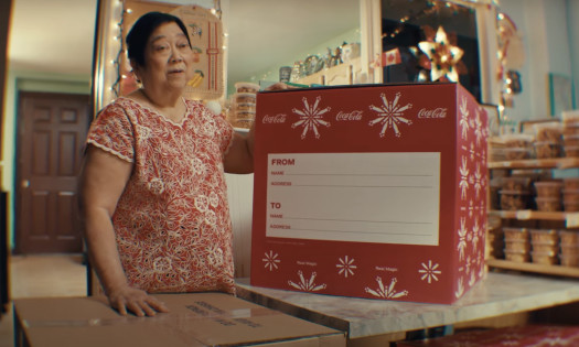 Aunt Rosita showing off the Coca-Cola 'Balikbayan Box'