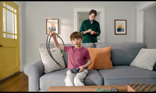 Kid holding slashed brake lines while the father eats Halo mandarin