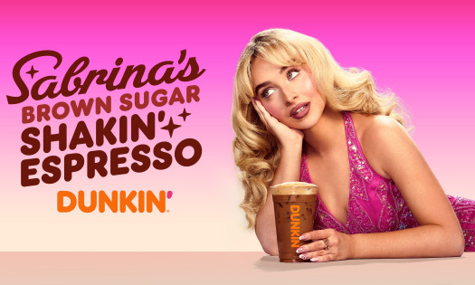 Sabrina Carpenter posing with her Dunkin' Brown Sugar Shakin' Espresso