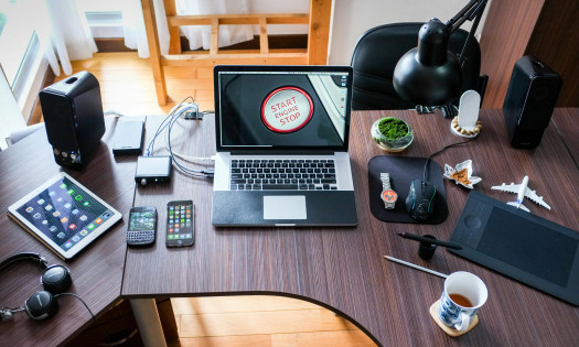 Different gadgets laid out on a work desk