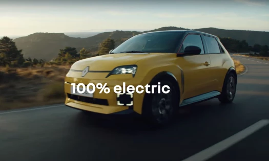 A yellow Renault EV on the road