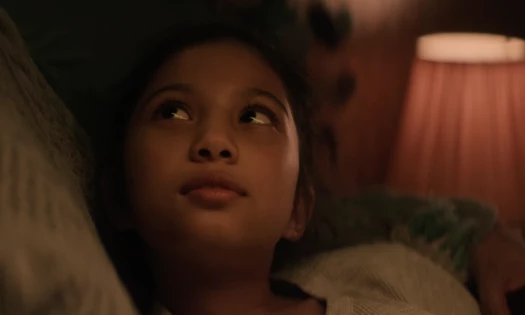 Daughter in bed while talking to her dad