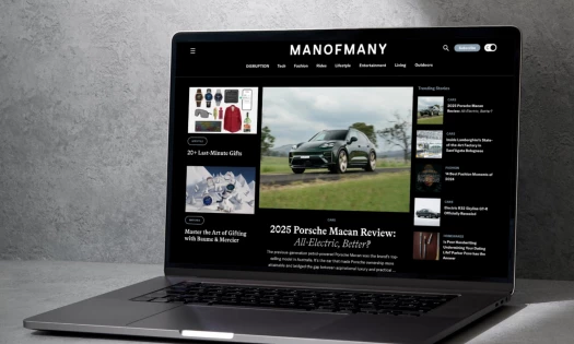 Man of Many website on laptop